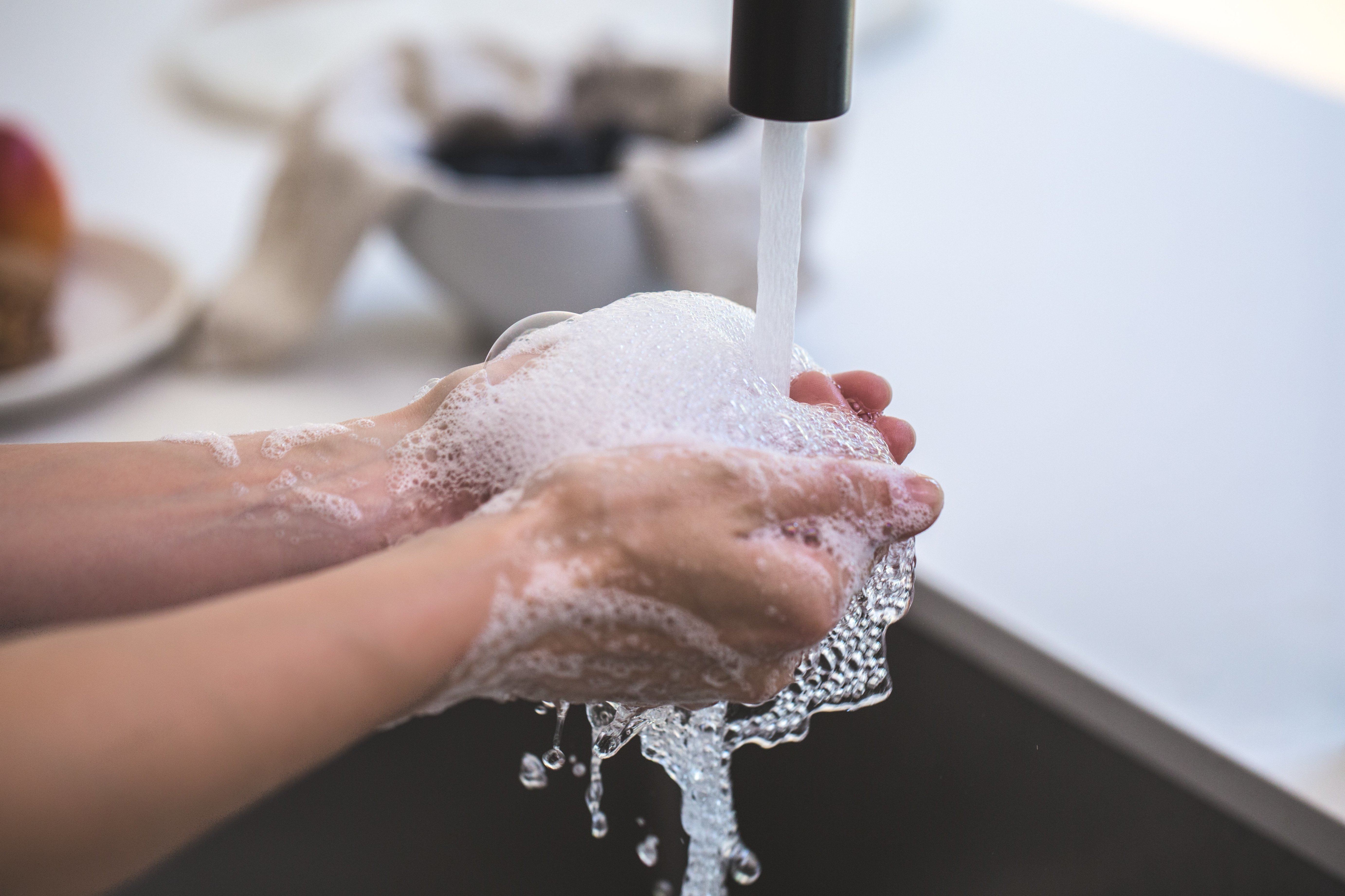 Rinsing-Soapy-Hands-In-Water_wFki7UTyySpQ